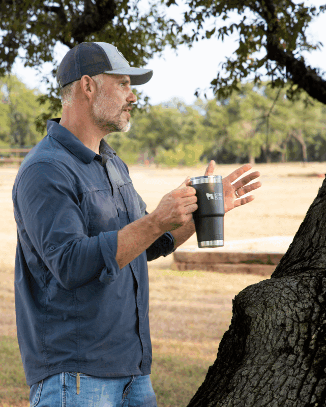 Attorney and law firm partner Nathaniel Palmer facilitating an executive leadership team during team building retreat at Horse + Bow near Austin, TX